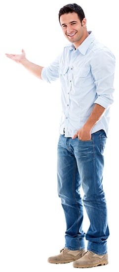 Man smiling and pointing to his right, left hand in his pocket.